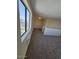 The loft has carpeted floors and a window that looks out to the neighborhood at 2255 W Bloomfield Rd, Phoenix, AZ 85029