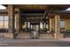 Inviting building entrance with stone pillars, glass doors, and a water feature at 23880 N 127Th St, Scottsdale, AZ 85255