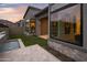 Home exterior featuring stone accents, a water feature, and lush landscaping at 23880 N 127Th St, Scottsdale, AZ 85255