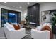 Inviting living room with modern fireplace, stylish furniture, and large sliding doors to the outdoors at 23880 N 127Th St, Scottsdale, AZ 85255