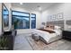 Serene main bedroom with large windows, plush carpeting, and tasteful decor elements at 23880 N 127Th St, Scottsdale, AZ 85255