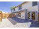 Fenced backyard features a patio with both gray stone and gravel, creating a cozy outdoor space at 2455 E Broadway Rd # 102, Mesa, AZ 85204