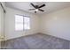 Bright bedroom featuring carpeting, neutral walls, and a large window offering plenty of natural light at 2455 E Broadway Rd # 102, Mesa, AZ 85204