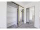 Mirrored sliding doors reveal custom shelving and storage solutions in this bedroom closet at 2455 E Broadway Rd # 102, Mesa, AZ 85204