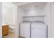 Convenient laundry closet with washer and dryer hookups, plus some storage and a nearby half-bath at 2455 E Broadway Rd # 102, Mesa, AZ 85204