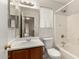 Clean bathroom with a vanity, toilet, and shower-tub combo with tile surround at 2546 E Camellia Dr, Gilbert, AZ 85296