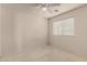 Bedroom with neutral carpet, ceiling fan, and natural light from window at 2546 E Camellia Dr, Gilbert, AZ 85296