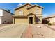 Charming two-story home with a two-car garage, landscaped front yard, and tile roof accents at 2546 E Camellia Dr, Gilbert, AZ 85296