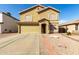 Charming two-story home with a two-car garage, landscaped front yard, and tile roof accents at 2546 E Camellia Dr, Gilbert, AZ 85296