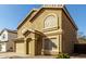 Inviting two-story home with a two-car garage, desert landscaping, and a tiled roof at 2546 E Camellia Dr, Gilbert, AZ 85296