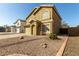 Inviting two-story home with a two-car garage, desert landscaping, and a tiled roof at 2546 E Camellia Dr, Gilbert, AZ 85296