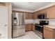 Kitchen with stainless steel refrigerator and appliances, plus tiled backsplash at 2546 E Camellia Dr, Gilbert, AZ 85296