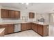 Spacious kitchen with stainless dishwasher and ample cabinetry and counter space at 2546 E Camellia Dr, Gilbert, AZ 85296