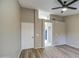 Bedroom with neutral color scheme, ceiling fan, a connecting bathroom and a view of the bed at 2560 S Rowen --, Mesa, AZ 85209