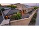 Aerial view of backyard with outdoor kitchen and dining area under a covered patio at 2678 S 172Nd Dr, Goodyear, AZ 85338