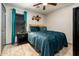 Bedroom with a cozy bed, teal colored drapes, and a large window for natural light at 2678 S 172Nd Dr, Goodyear, AZ 85338