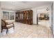 Additional living space with tile flooring, recessed lighting, built-in cabinets, and view to main living area at 2678 S 172Nd Dr, Goodyear, AZ 85338