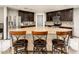 Gourmet kitchen with a large island, granite countertops, stainless steel appliances, and bar stool seating at 2678 S 172Nd Dr, Goodyear, AZ 85338