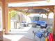 Inviting outdoor patio with a cozy seating area, kitchenette, and Dallas Cowboys decor, perfect for relaxing and entertaining at 2678 S 172Nd Dr, Goodyear, AZ 85338