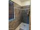 Tiled walk-in shower with decorative tile accents at 2678 S 172Nd Dr, Goodyear, AZ 85338