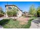 Expansive backyard with grass and a shade tree, offering an ideal space for outdoor activities and relaxation at 2741 E Bridgeport Pkwy, Gilbert, AZ 85295