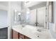 Bright bathroom with a double sink vanity, framed mirror, and white storage, creating a clean, functional space at 2741 E Bridgeport Pkwy, Gilbert, AZ 85295