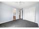 Bedroom showcasing neutral paint, carpet, and an ensuite bathroom at 2741 E Bridgeport Pkwy, Gilbert, AZ 85295