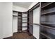 Walk-in closet with ample shelving and racks, providing plenty of storage space and organization options at 2741 E Bridgeport Pkwy, Gilbert, AZ 85295