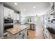 A bright kitchen with white cabinets, stainless steel appliances, and a granite-topped island at 2741 E Bridgeport Pkwy, Gilbert, AZ 85295