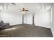 Large primary bedroom featuring a tray ceiling, carpeting, and great natural light creating a warm, inviting space at 2741 E Bridgeport Pkwy, Gilbert, AZ 85295