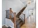 Carpeted staircase with stained wood and iron railing leading to the upper level at 2741 E Bridgeport Pkwy, Gilbert, AZ 85295