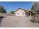 Side view of backyard with gravel and covered patio at 3001 E Amber Ridge Way, Phoenix, AZ 85048