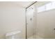 Bathroom featuring a glass shower door and a white toilet at 3001 E Amber Ridge Way, Phoenix, AZ 85048