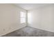 Bright bedroom featuring neutral walls, carpet, and a window providing natural light at 3001 E Amber Ridge Way, Phoenix, AZ 85048