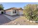 This single-story residence is enhanced by gravel landscaping, enhancing its curb appeal at 3001 E Amber Ridge Way, Phoenix, AZ 85048