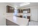 Efficient kitchen layout featuring ample counter space, white appliances, and dark wood cabinets at 3001 E Amber Ridge Way, Phoenix, AZ 85048