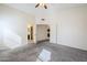 Main bedroom features neutral carpet and white walls, along with access to the bathroom at 3001 E Amber Ridge Way, Phoenix, AZ 85048