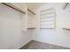 Walk-in closet features open shelving, and neutral carpet at 3001 E Amber Ridge Way, Phoenix, AZ 85048