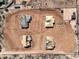 Aerial view of four houses under construction on a 1-acre lot with desert landscaping at 33402 N 142Nd Way, Scottsdale, AZ 85262