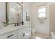 Bright bathroom featuring a stylish vanity with quartz countertops and decorative accents at 33417 N 142Nd Way, Scottsdale, AZ 85252