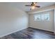 Bright bedroom features a window letting in natural light and dark wood floors at 3823 N 28Th St, Phoenix, AZ 85016