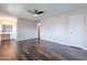 Comfortable bedroom showcasing wood floors, ceiling fan, vanity area with sink, and closet space at 3823 N 28Th St, Phoenix, AZ 85016