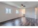 Inviting bedroom featuring wood floors, ceiling fan, windows, and vanity area with sink at 3823 N 28Th St, Phoenix, AZ 85016