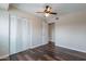 Bedroom features dark wood floors, a ceiling fan, and a closet at 3823 N 28Th St, Phoenix, AZ 85016