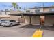 Assigned carport next to a black convertible car; unit number 3823 is visible on the storage closet at 3823 N 28Th St, Phoenix, AZ 85016