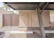 Assigned carport with a small storage unit featuring unit number 3823 and a wooden privacy gate at 3823 N 28Th St, Phoenix, AZ 85016