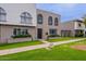 Townhouse exterior showcasing a lush lawn and classic architectural style at 3823 N 28Th St, Phoenix, AZ 85016