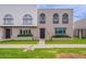 Charming townhouse featuring a well-manicured lawn and unique architectural details at 3823 N 28Th St, Phoenix, AZ 85016