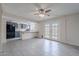 Spacious living room featuring tile flooring, and access to the kitchen and backyard at 3823 N 28Th St, Phoenix, AZ 85016