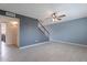 Bright living room featuring tile flooring, a ceiling fan, and stairs to the second level at 3823 N 28Th St, Phoenix, AZ 85016